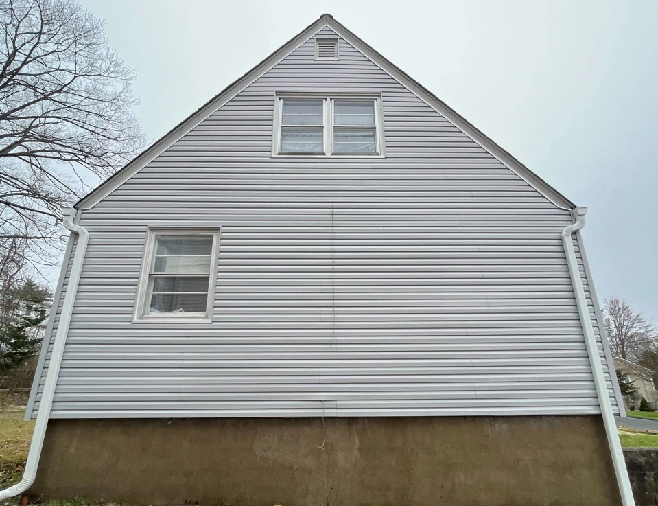 Akron Power Washing technician performing detailed house washing in Akron residential area
